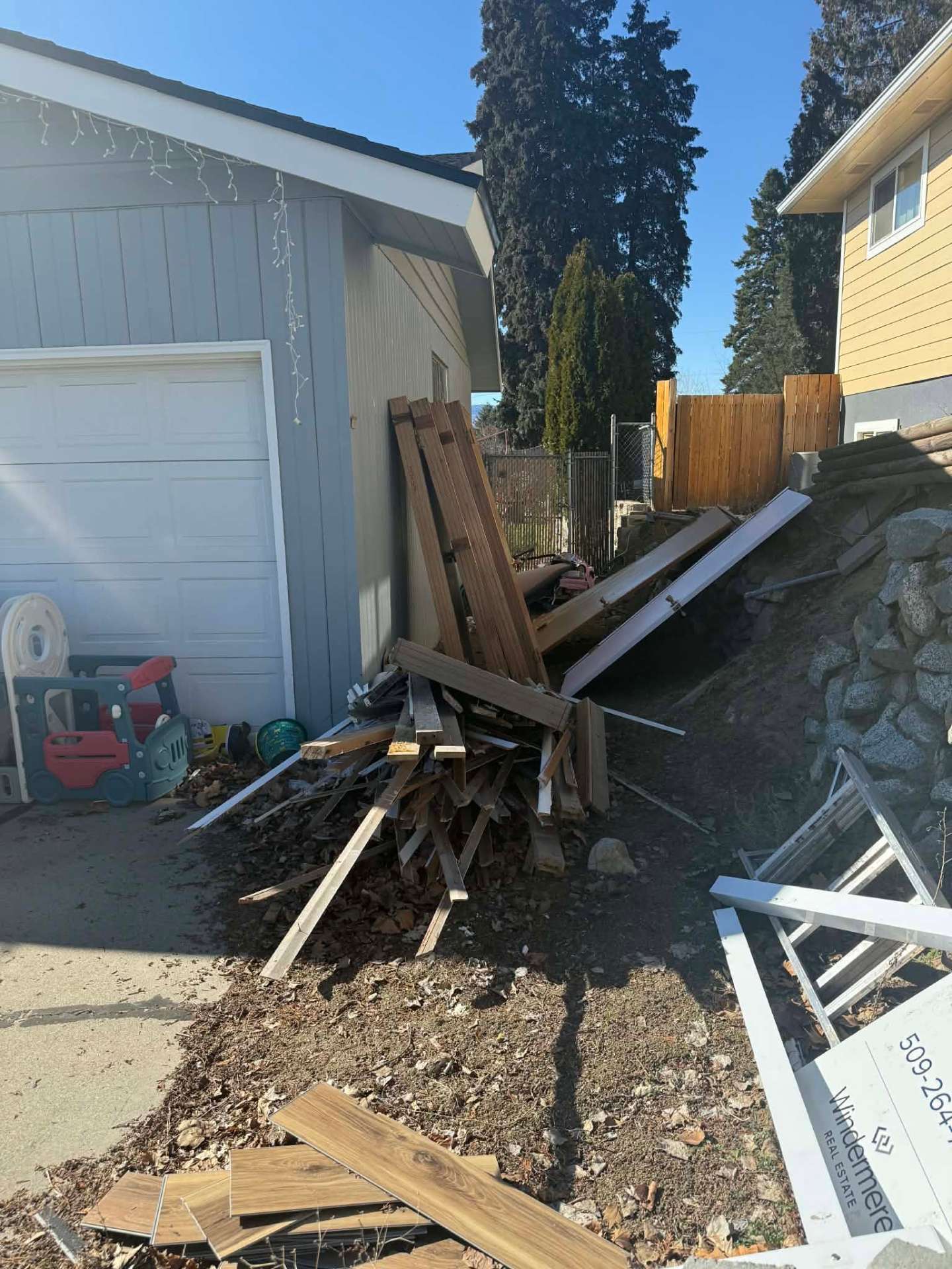 Before photo, Side yard lumber and debris haul off in Wenatchee, WA