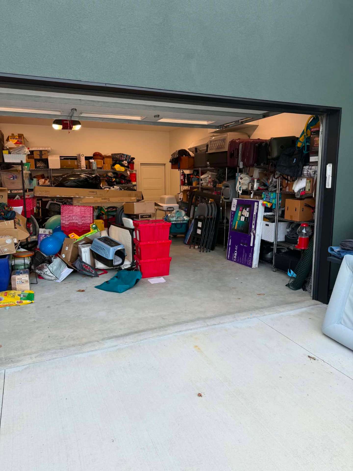 Before photo, Two car garage cleanout and shelving in East Wenatchee, WA