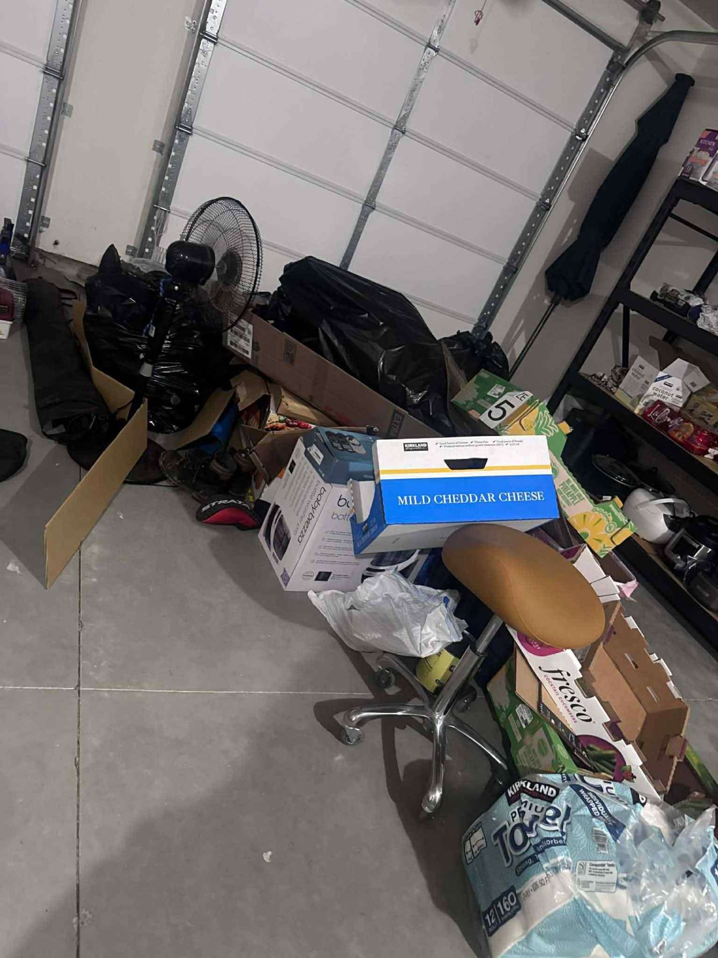 Before photo, Garage floor cleared and shelves organized in East Wenatchee, WA