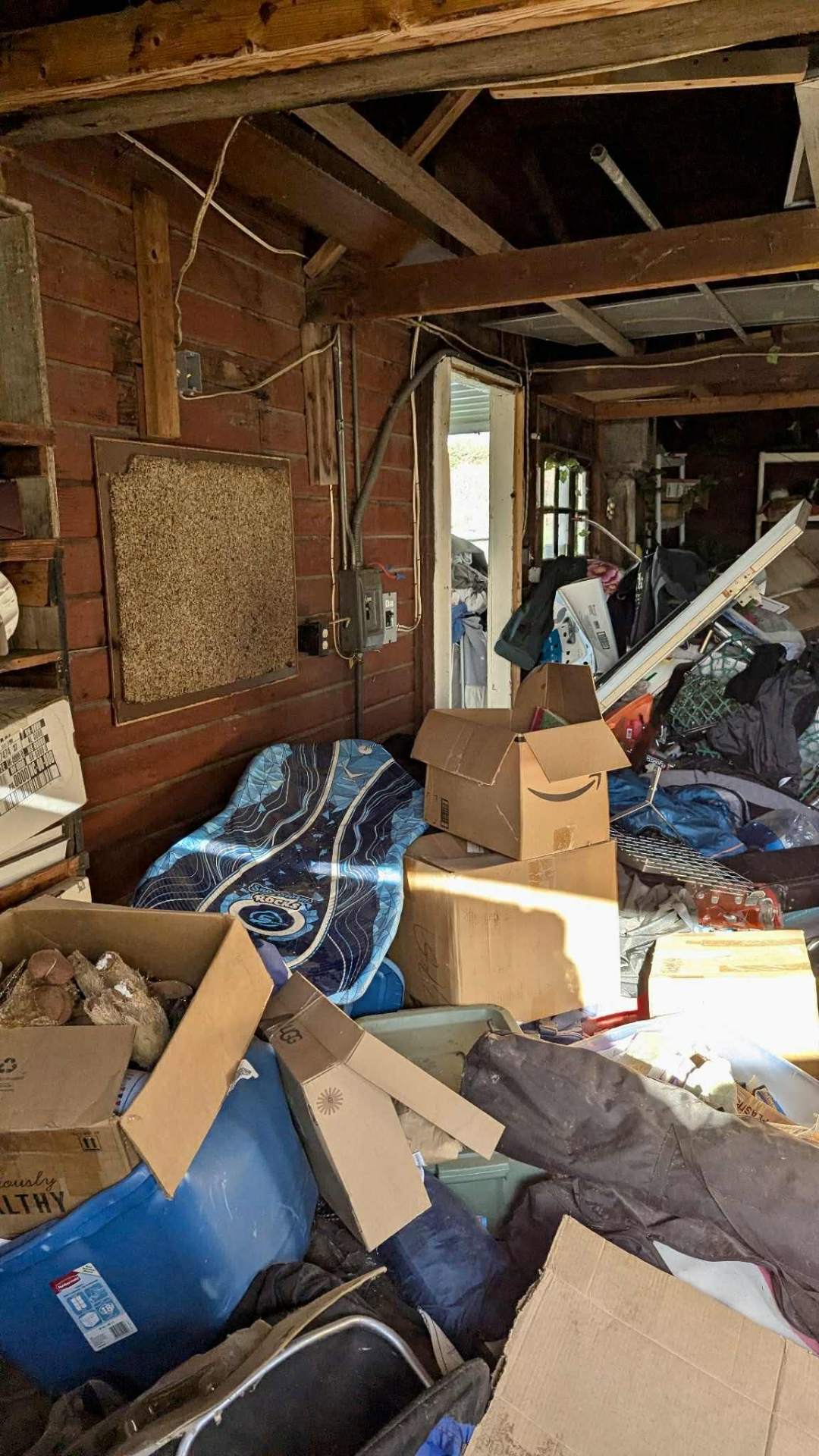 Before photo, Shed declutter and floor reclaim in Wenatchee, WA